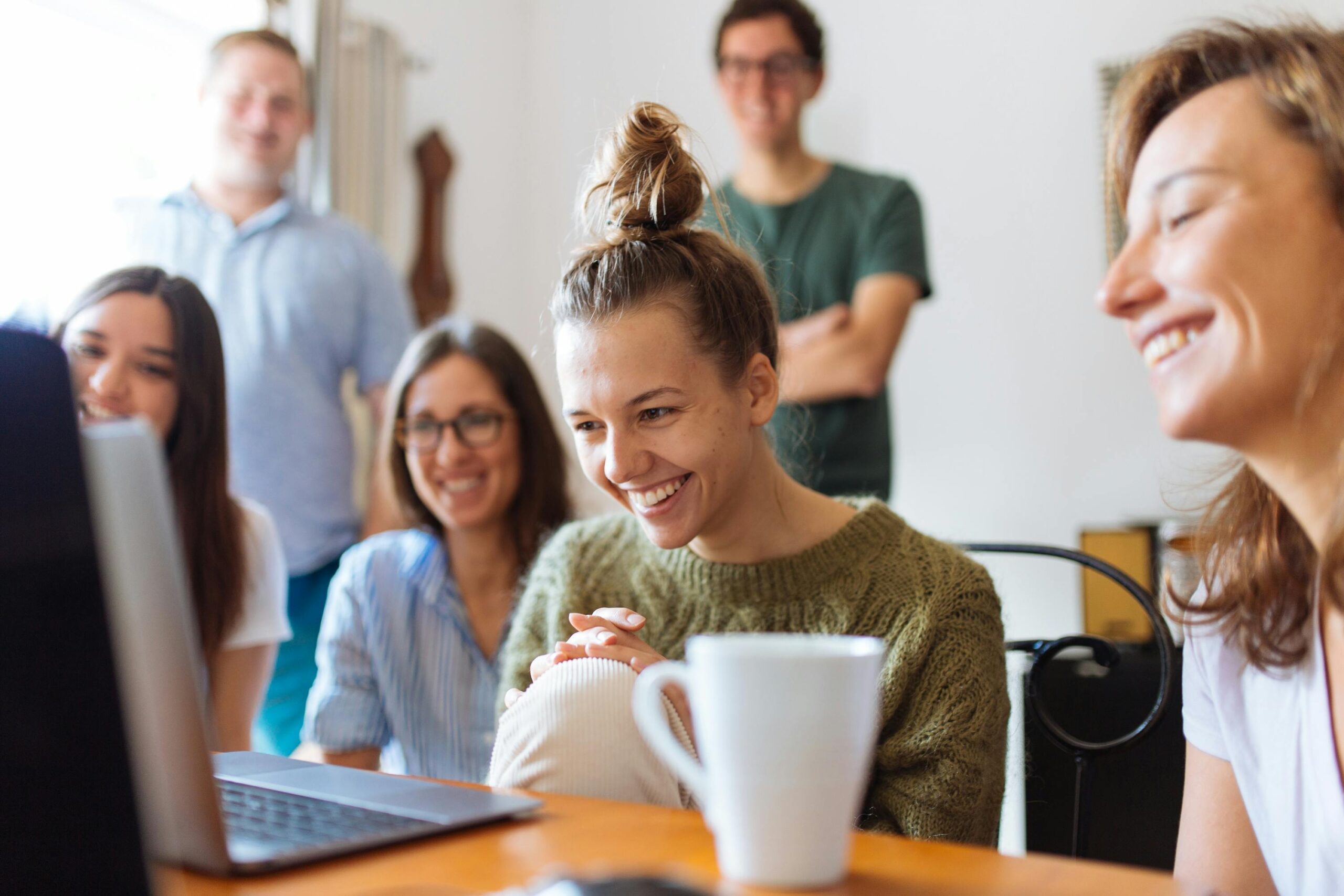 Group of friends talking to someone via computer